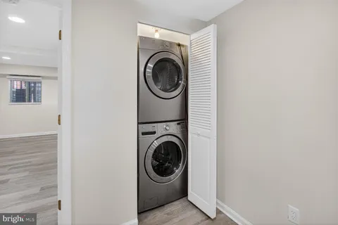 a utility room with sink washer and dryer