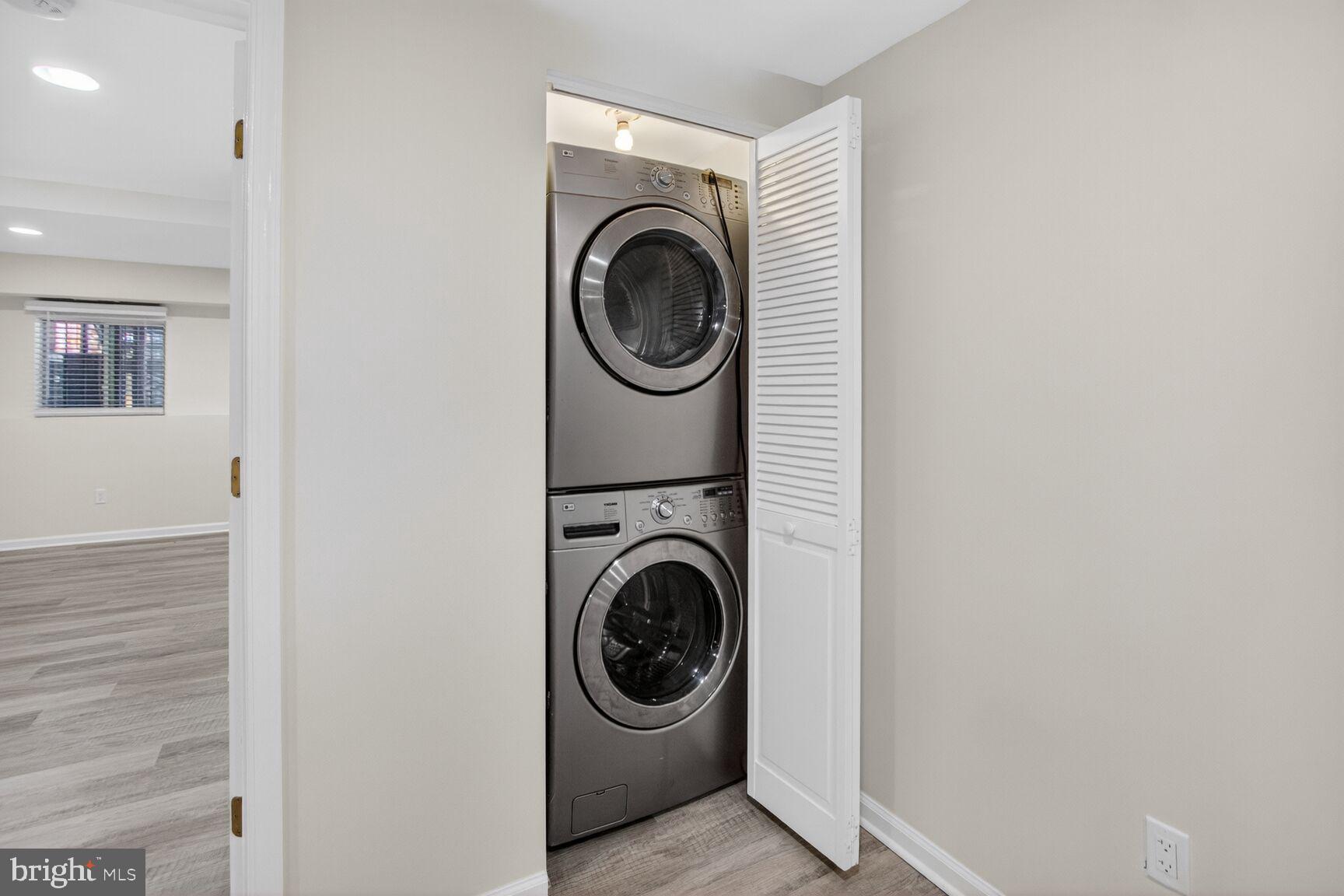 456 M Street Northwest, Unit 1 Washington, DC 20001 - Photo 17 of 19 a utility room with sink washer and dryer