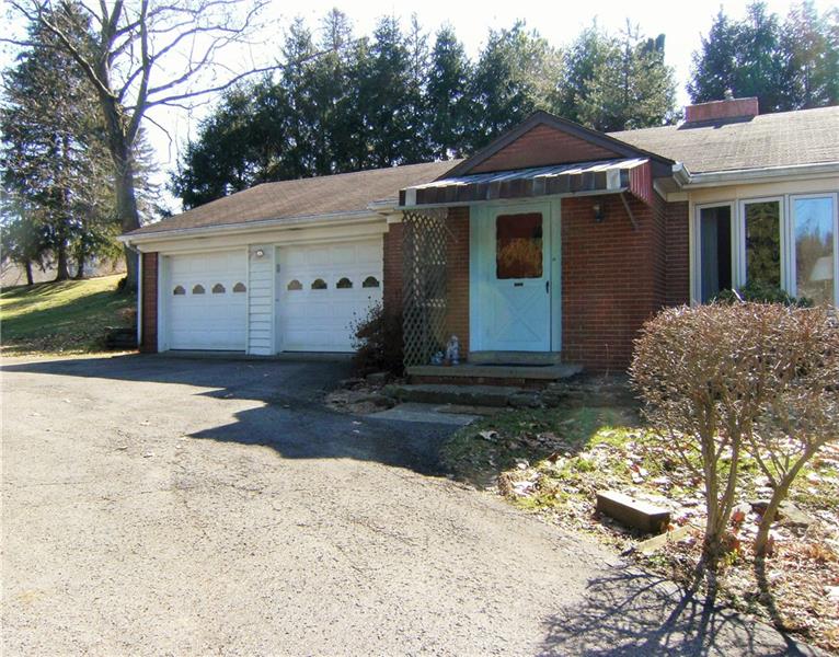 Closer view Of Front Showing Large 2 Car Garage And Covered Front Porch