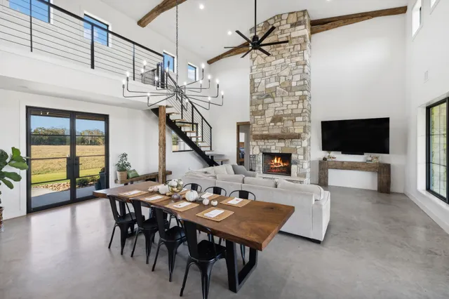 a view of a dining area with furniture and a large window