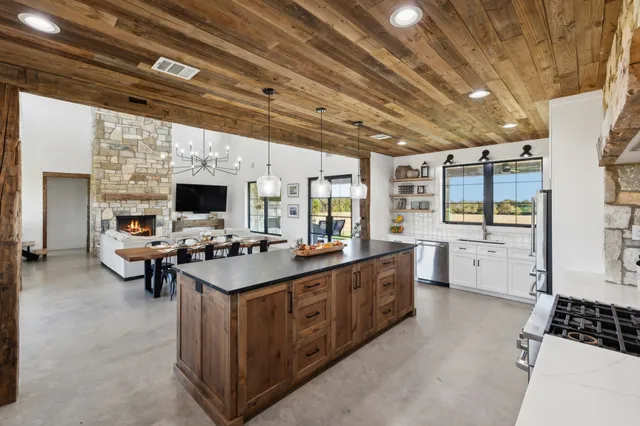 a kitchen with a sink a cabinets and window