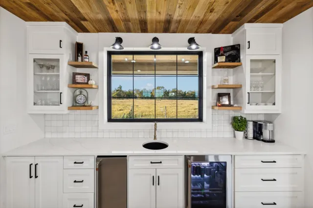 a kitchen with a sink and a window