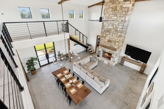a spacious bedroom with two beds and a chandelier