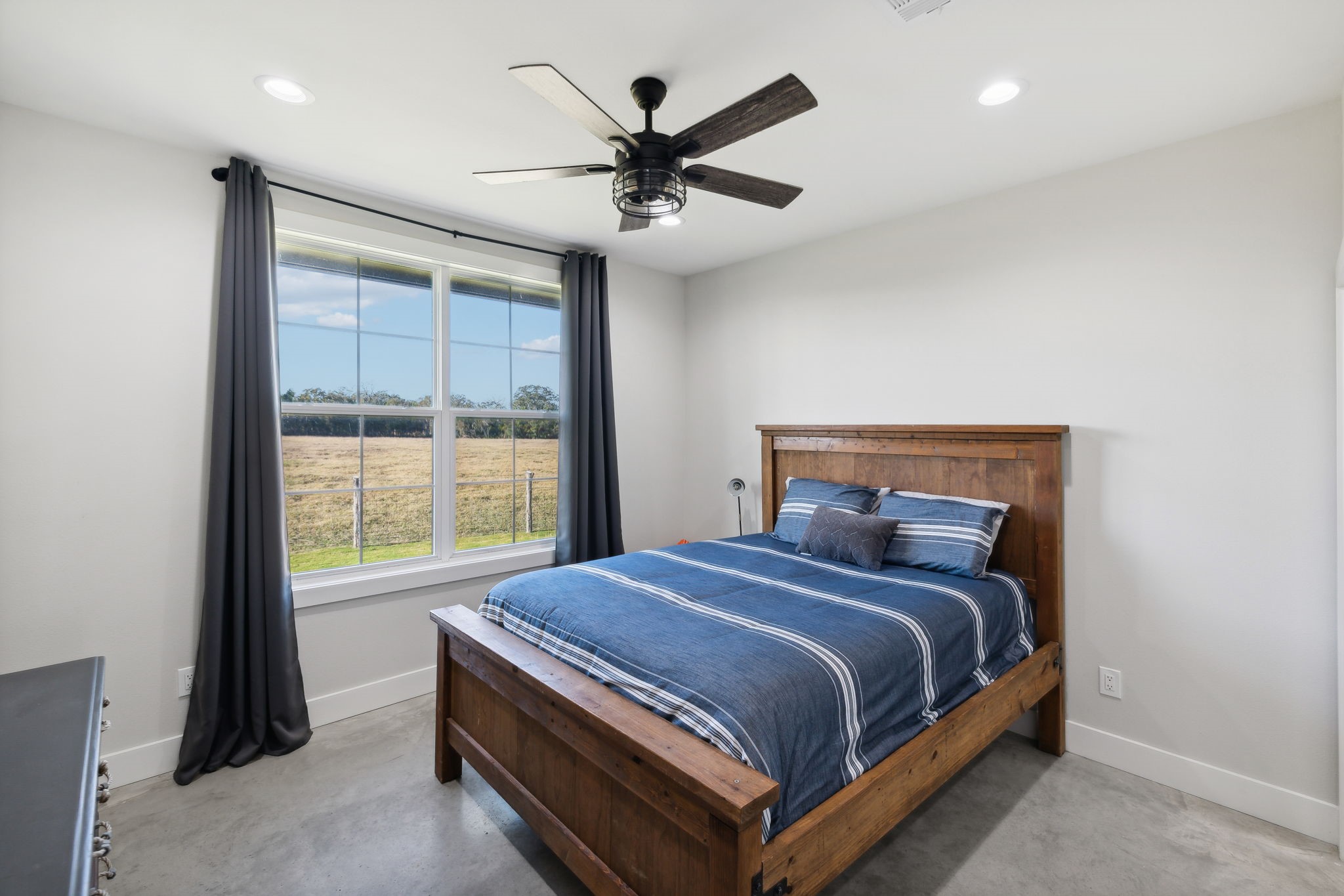 10433 County Road 162 Somerville, TX 77879 - Photo 23 of 40 a bed room with a bed and a window