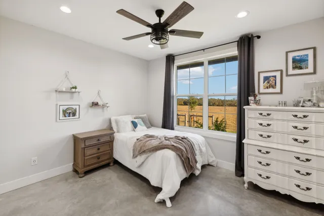 a view of a big house with a yard and plants
