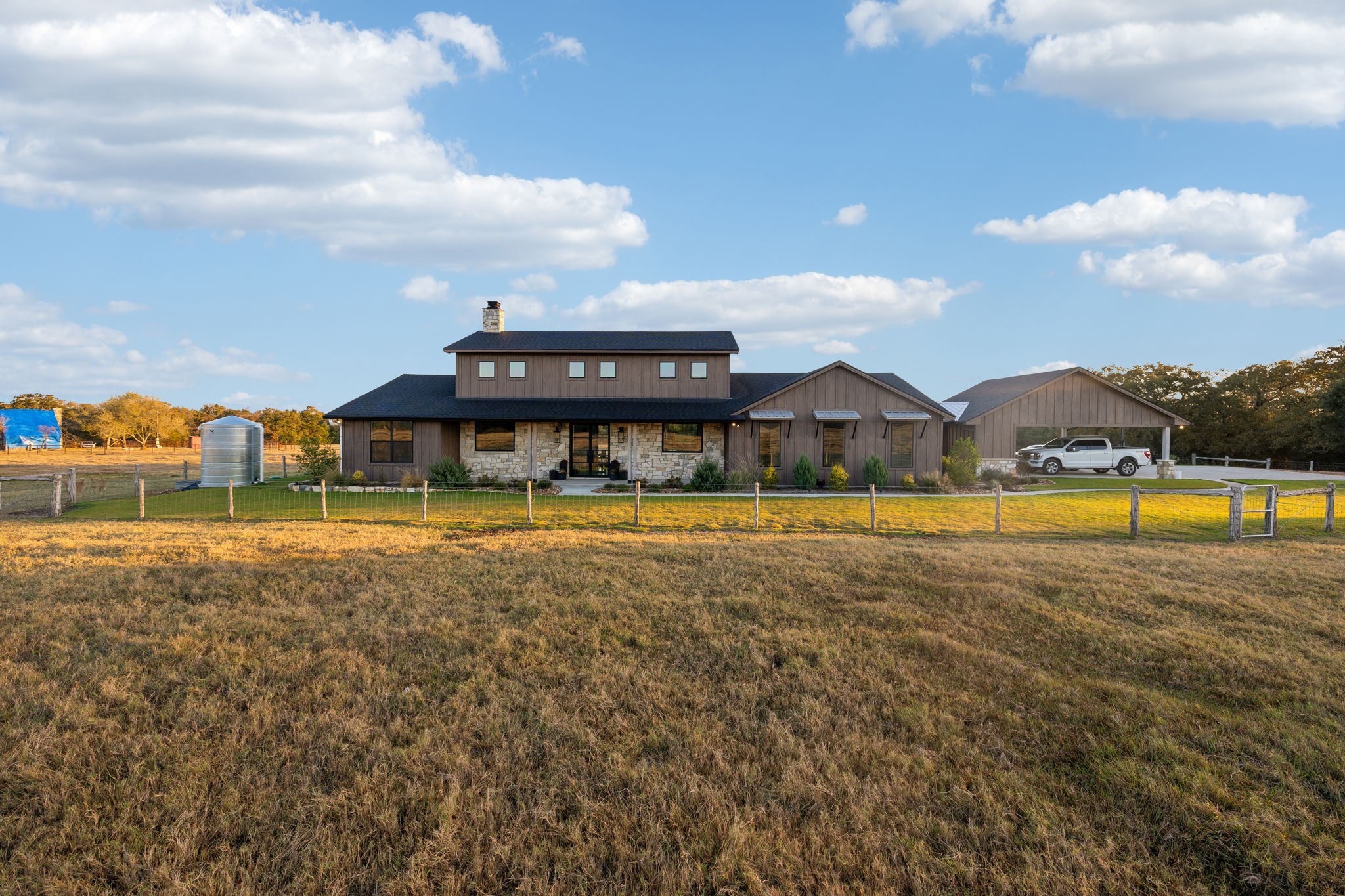 10433 County Road 162 Somerville, TX 77879 - Photo 5 of 40 a view of swimming pool with lawn chairs and large trees