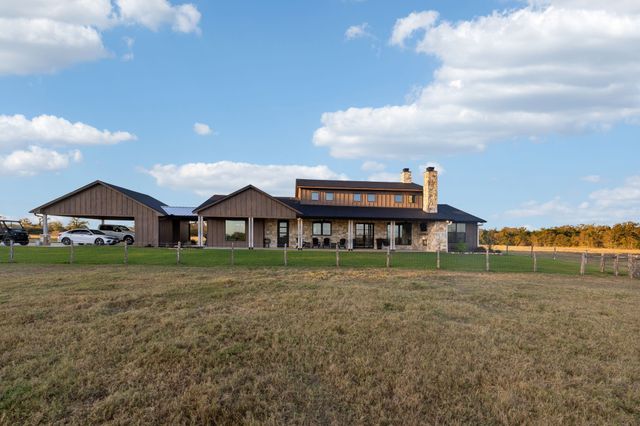 a view of a livingroom with furniture and a flat screen tv