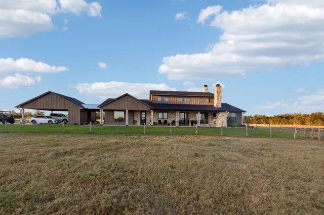 a view of a livingroom with furniture and a flat screen tv