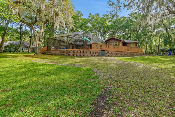 a yellow house sitting in middle of the middle of a field