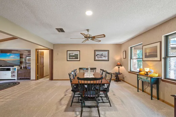 a view of a dining room with furniture window and outside view