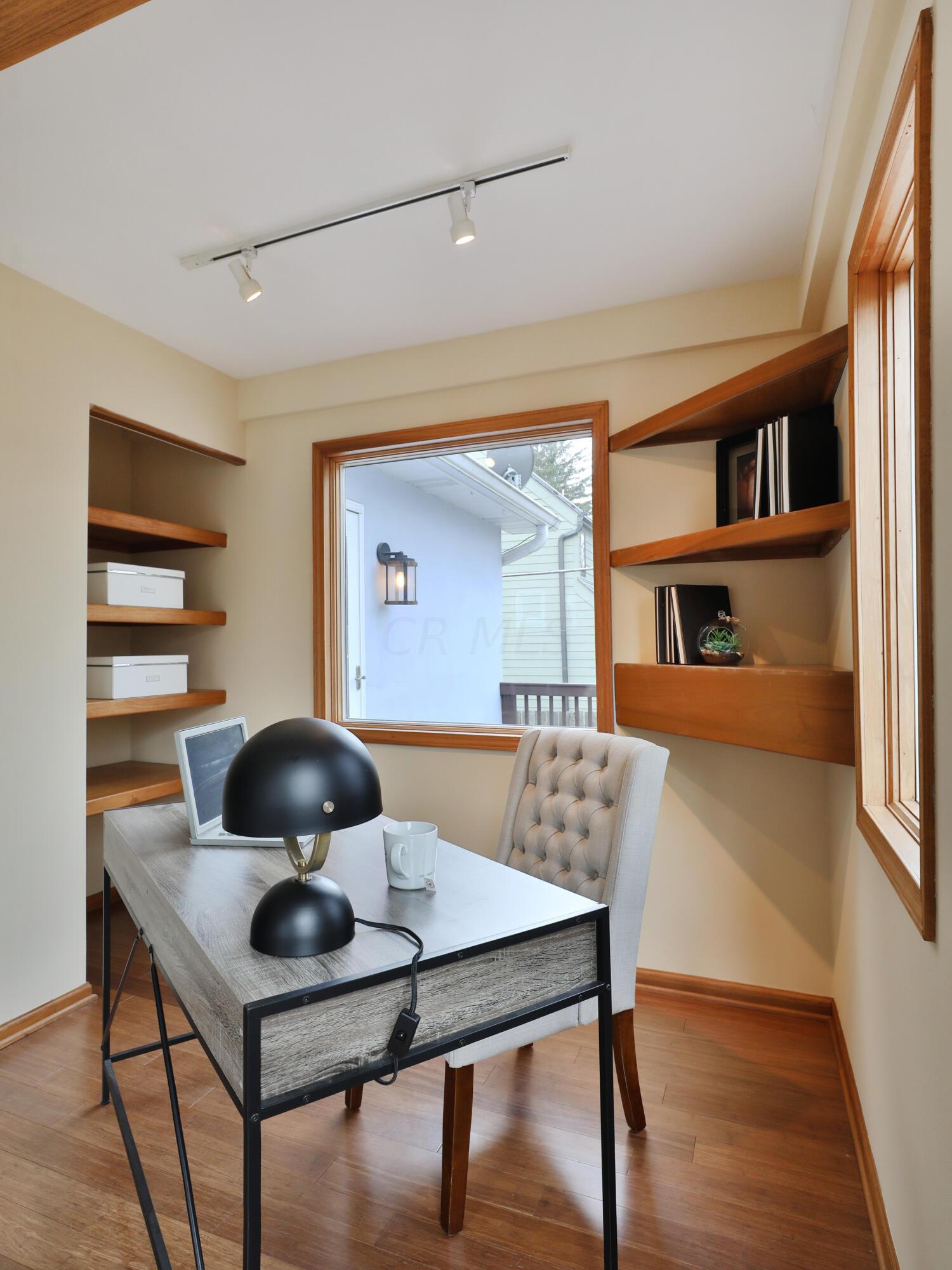 2180 Bryden Road Columbus, OH 43209 - Photo 26 of 56 Built-in shelving and track lighting.