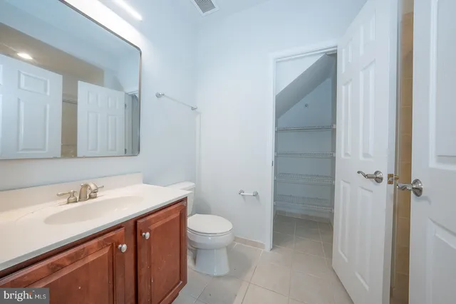 a room with window and white walls