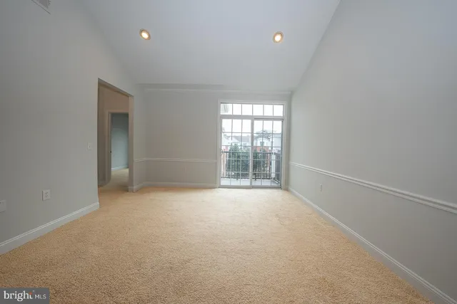 a view of a balcony with wooden floor and fence