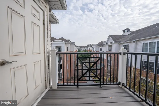 a view of a balcony with wooden floor