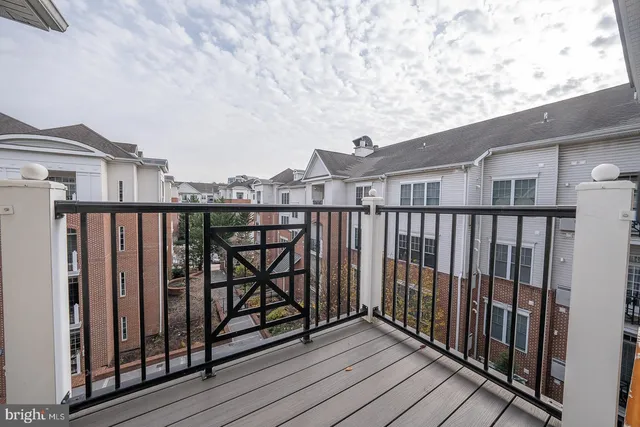 a view of a room with furniture and a chandelier