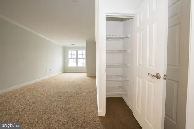a view of a chandelier fan and wooden floor