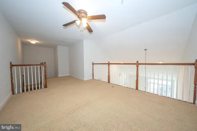 a view of a chairs and table in backyard of a building