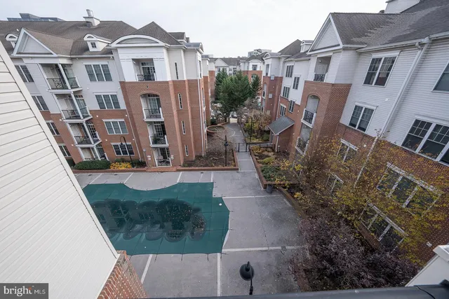 a city view with tall buildings and outdoor seating