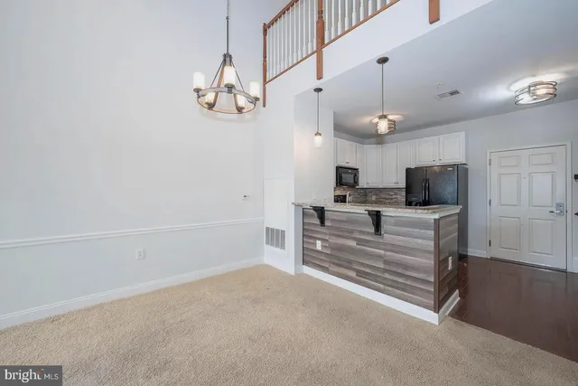 a view of entryway with wooden floor and stairs