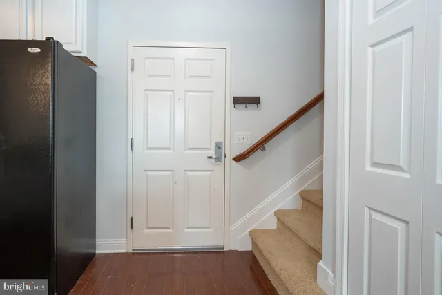 a kitchen with a sink stove and refrigerator