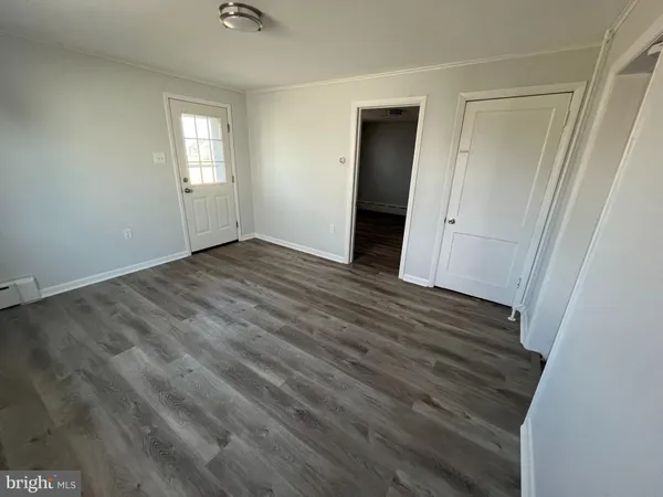 a kitchen with a refrigerator sink and cabinets
