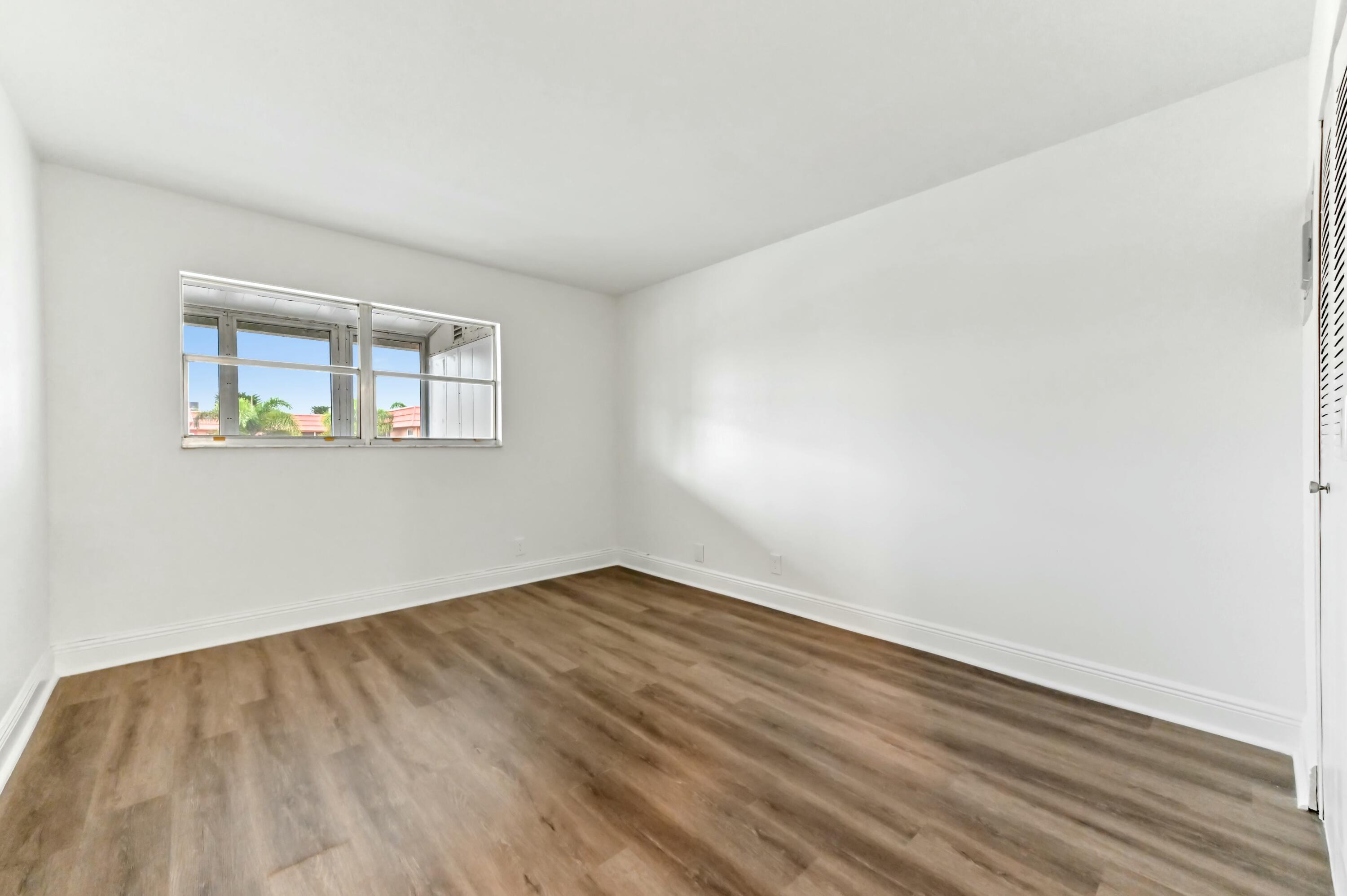 513 Saxony Drive Delray Beach, FL 33446 - Photo 12 of 40 new vinyl flooring primary bedroom