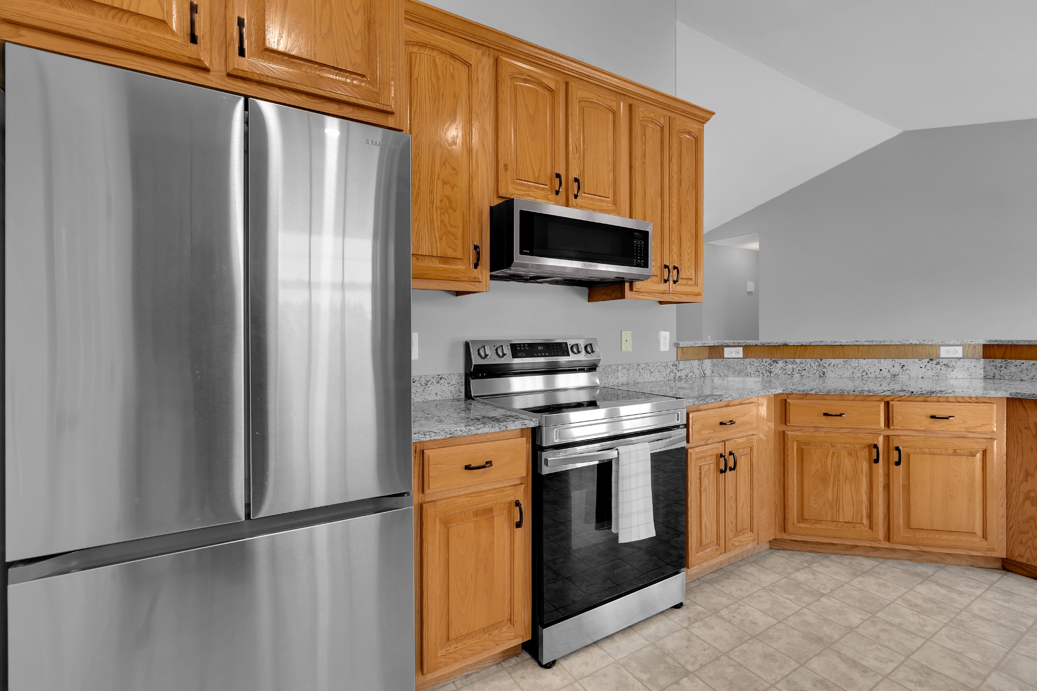 3896 Lynchburg Road Winchester, TN 37398 - Photo 18 of 57 a kitchen with stainless steel appliances granite countertop a refrigerator stove and microwave