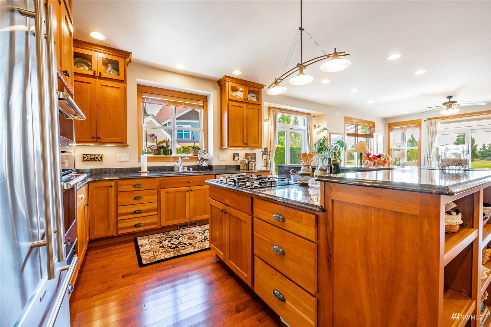 8858 Depot Road, Unit A Lynden, WA 98264 - Photo 14 of 40 a large kitchen with kitchen island granite countertop a large window and a counter space
