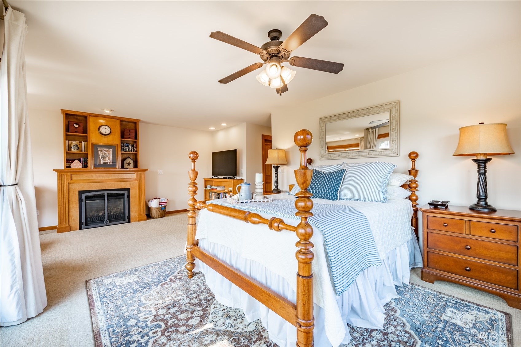 8858 Depot Road, Unit A Lynden, WA 98264 - Photo 28 of 40 a bed room with a bed and a fireplace