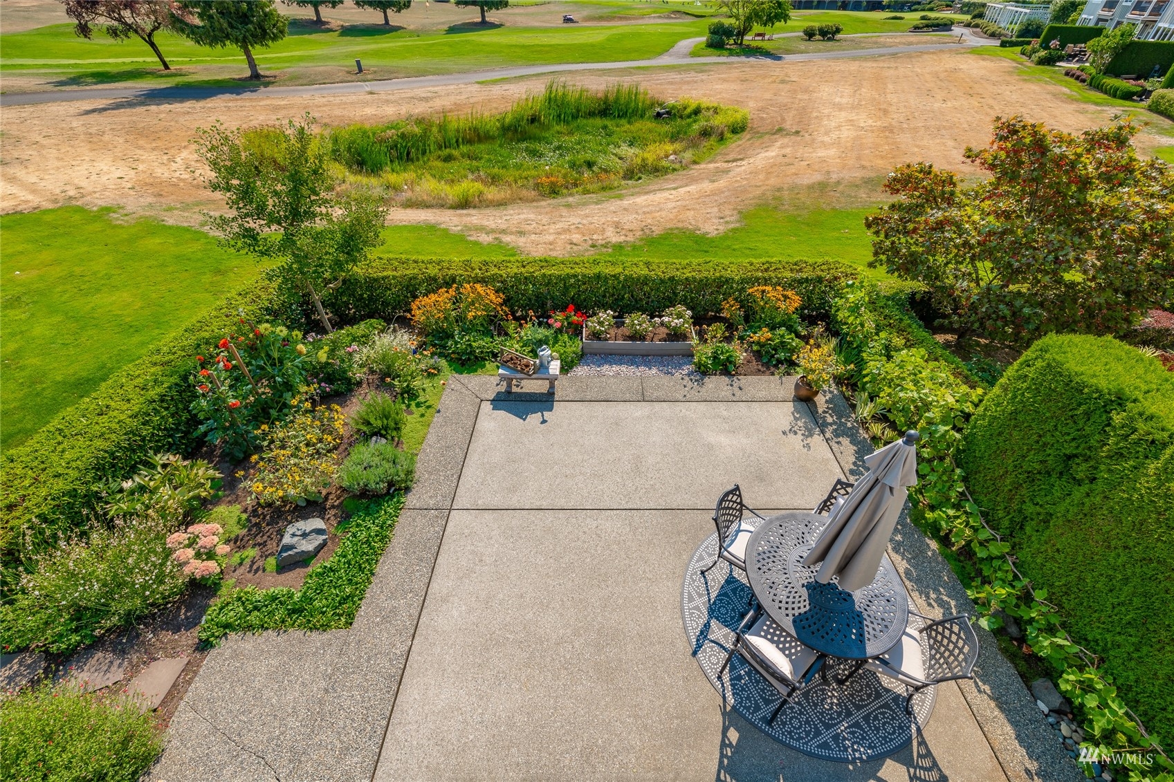 8858 Depot Road, Unit A Lynden, WA 98264 - Photo 34 of 40 a view of a garden with a bench and yard
