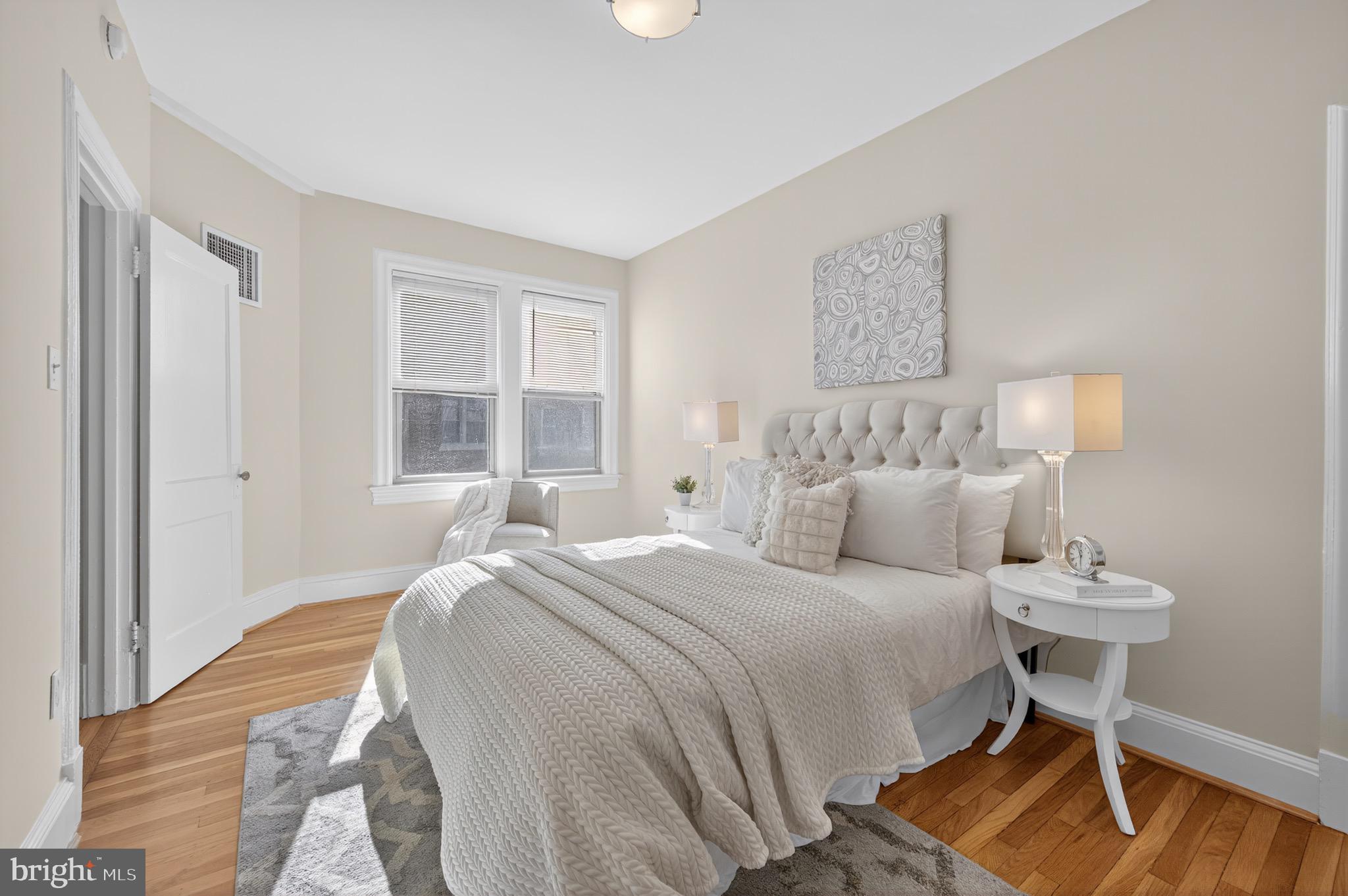 3446 Connecticut Avenue Northwest, Unit 305 Washington, DC 20008 - Photo 11 of 15 a bedroom with a bed and a window