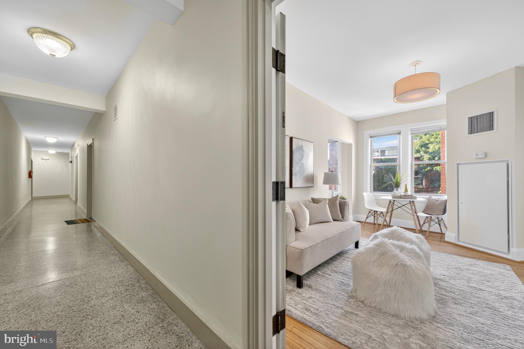 3446 Connecticut Avenue Northwest, Unit 305 Washington, DC 20008 - Photo 14 of 15 a living room with furniture and a large window