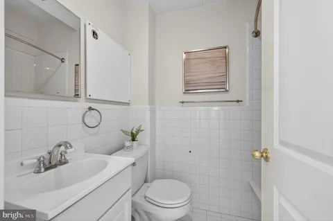 a bathroom with a sink toilet and vanity