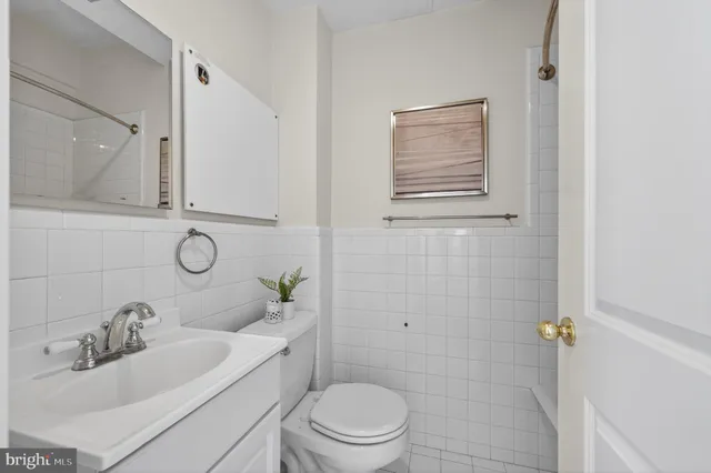 a bathroom with a sink toilet and vanity