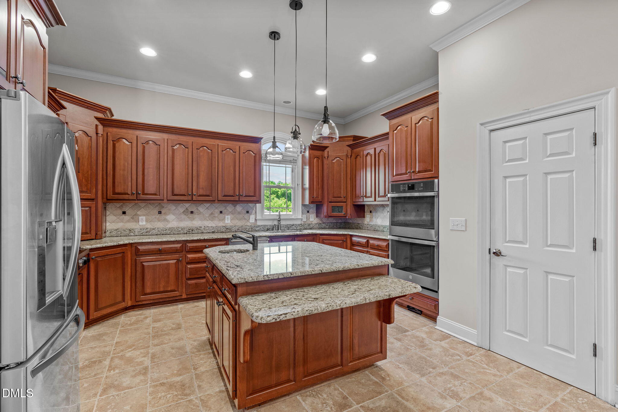 10917 Jordan Road Raleigh, NC 27603 - Photo 16 of 58 a kitchen with stainless steel appliances granite countertop a refrigerator and a sink