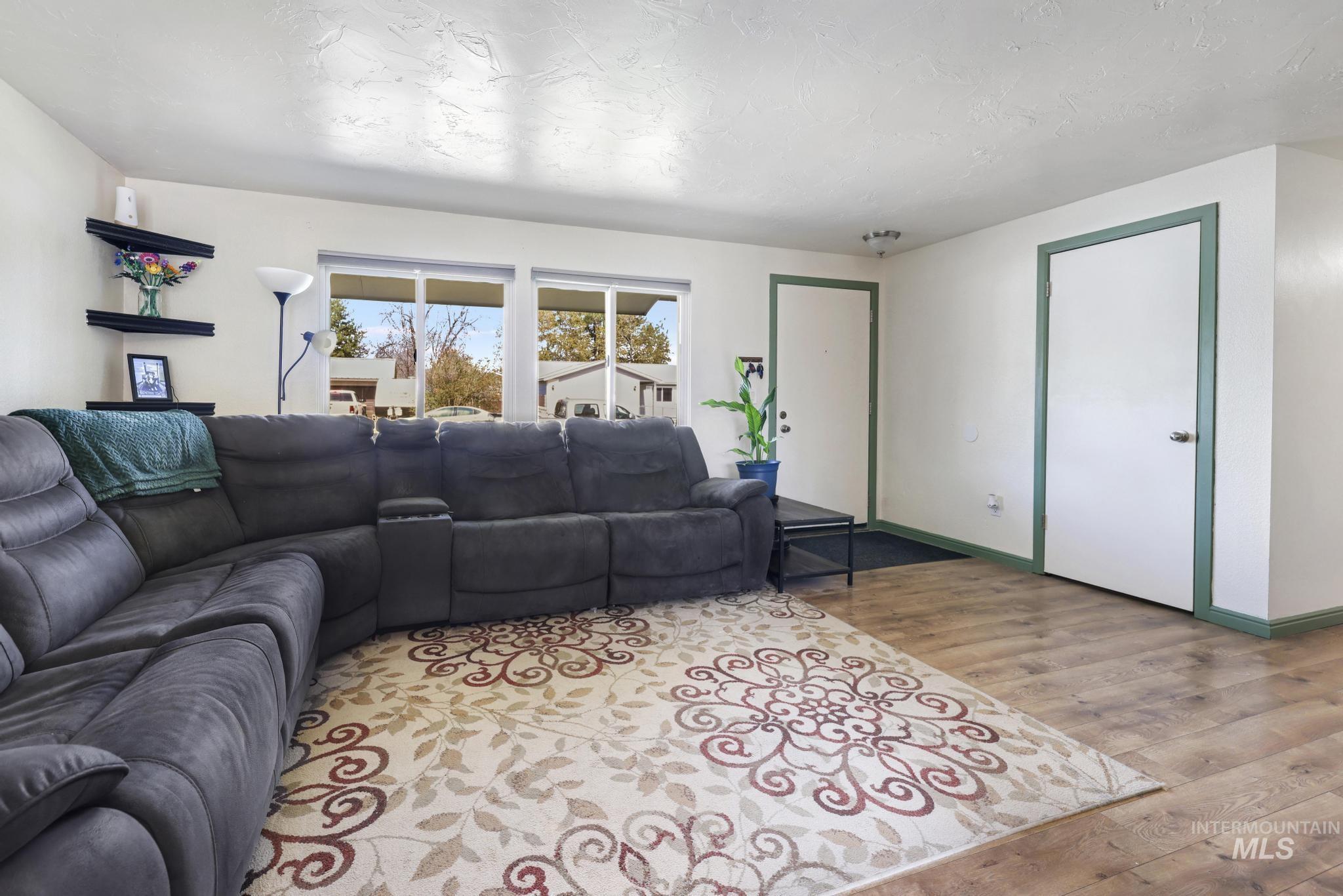 433 Ridgeway Drive Twin Falls, ID 83301 - Photo 2 of 18 Living room featuring light wood-type flooring and baseboards