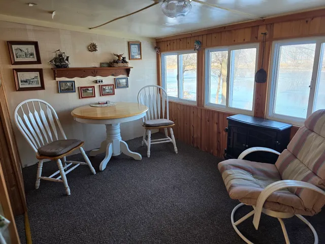 a dining room with furniture and windows