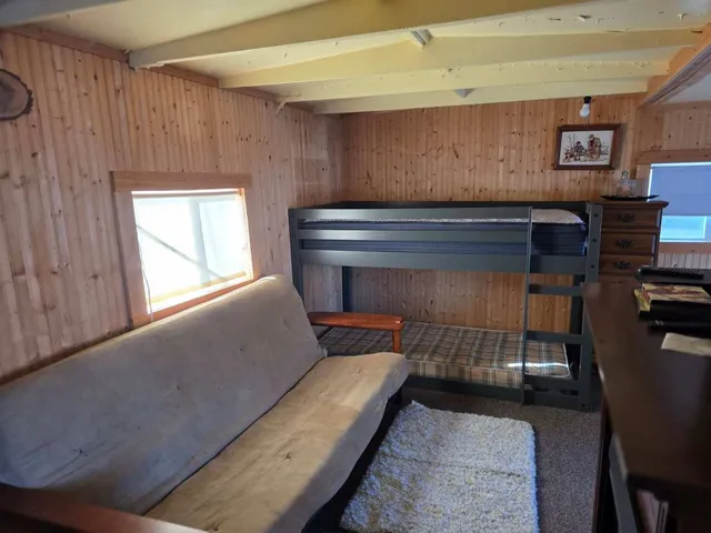 a living room with a couch and a window