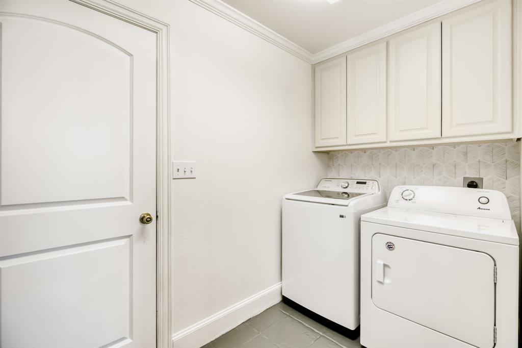 603 Ash Street Pilot Point, TX 76258 - Photo 24 of 28 Dedicated laundry area featuring white shaker-style cabinetry, a decorative tiled backsplash, and crown molding