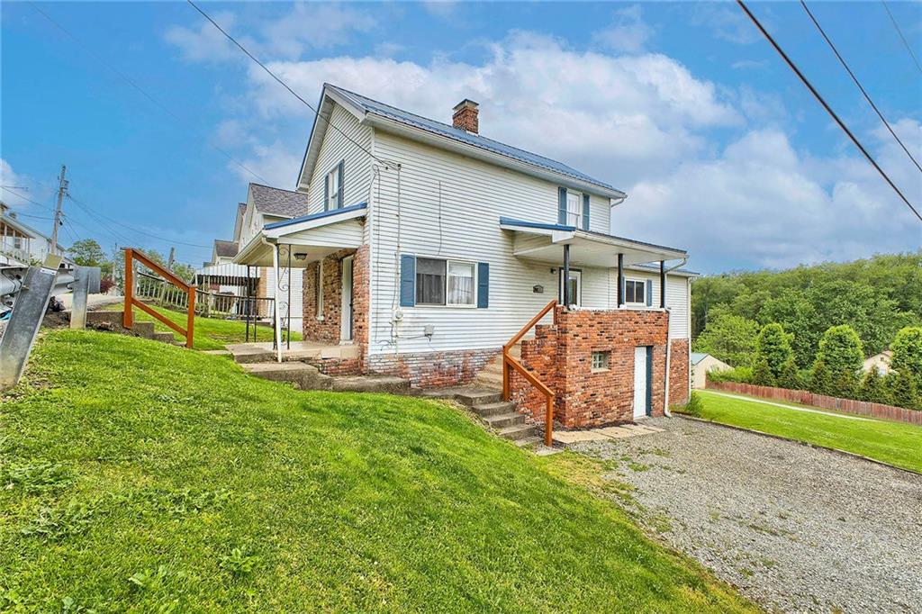 8002 Hayward Street Irwin, PA 15642 - Photo 2 of 31 front view of a house with a yard