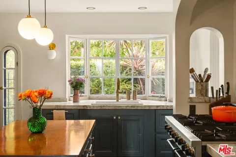 a view of a dining room with furniture window and outside view