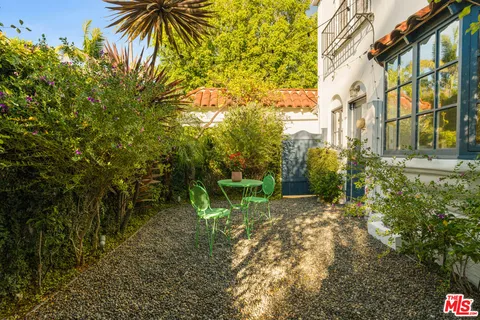 a view of a living room with furniture and wooden floor