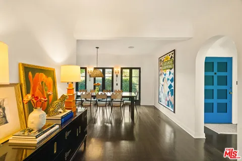 a bathroom with a granite countertop sink a mirror a vanity and shower