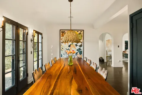 a bathroom with a sink and a chandelier