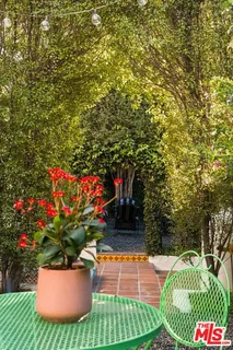 a view of a closet area with wooden floor