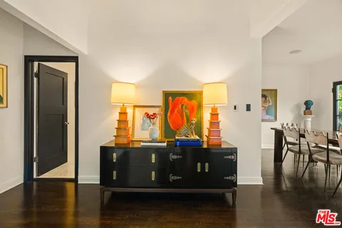 a spacious bathroom with double vanity and a bathtub