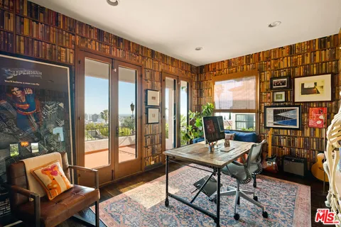 a bathroom with a toilet shower and mirror