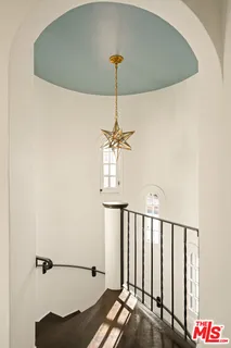 a bedroom with a bed and a television