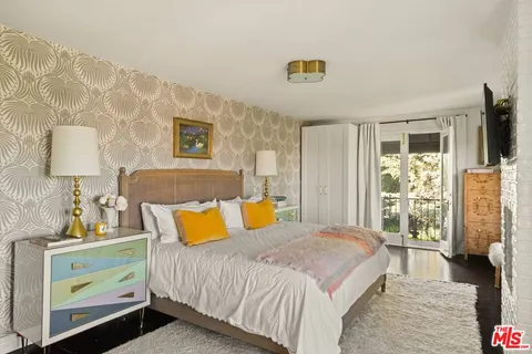 a bathroom with a sink mirror and a window