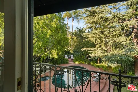 a view of living room with a couch and a fireplace